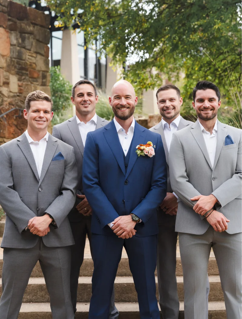 Groom and groomsmen wearing custom suits from Davelle Clothiers